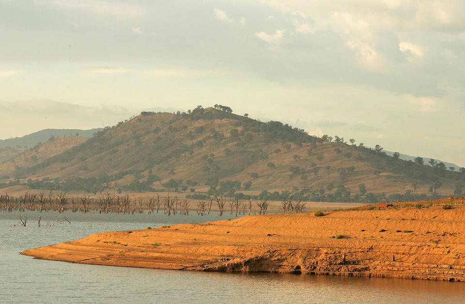 ALBURY, AUSTRALIA - FEBRUARY 23:  A view of the Hume Weir at sunrise on February 23, 2007 in Albury, Australia. The Hume Weir is the largest dam on the River Murray and is currently at two percent capacity, the lowest level ever for the weir. When full the weir has a capacity of 3,038 Gigalitres and was built to manage water for irrigation in Victoria, New South Wales and South Australia. The Hume Reservoir covers a total of 1,538,000 hectares. Reports suggest that inflow to the Murray-Darling Basin is at an all time low, now 60 percent lower than the previous minimum. Located in the south-east of Australia, the Murray-Darling Basin covers 1,061,469 square kilometres, comprising about 14 per cent of the continental landmass. Some seventy percent of the river's water is used for irrigation. In the midst of the worst drought on record, the federal government, along with, Victoria, New South Wales, South Australia, Queensland and South Australia are examining ways to secure water supplies and to adjust the operations of their river systems to maximize flexibility and minimize losses from the system.  Source: Getty