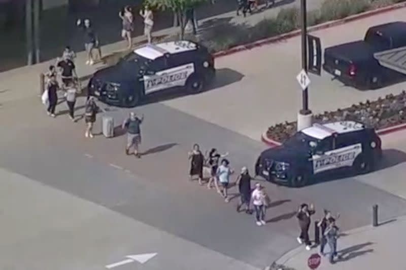 Police respond to a shooting in the Dallas area's Allen Premium Outlets