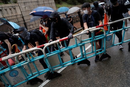 Anti-government protesters set up a barricade in Kowloon district, in Hong Kong