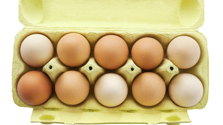 fresh eggs in yellow carton