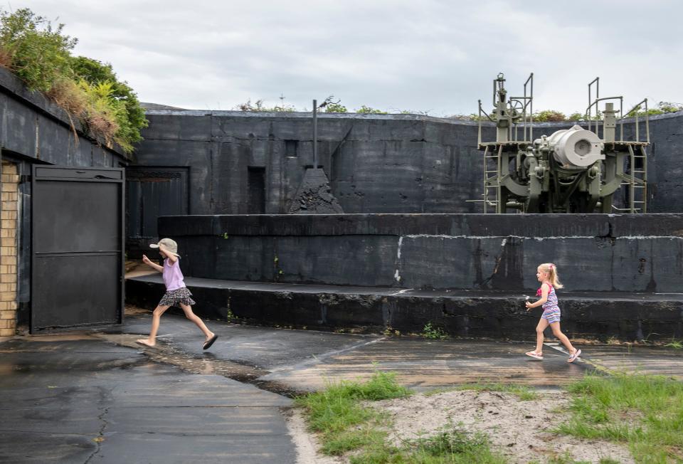 Addie Rowe, 7, left, and her sister Aubrey Rowe, 3, of Fayetteville, Arkansas, scamper about while exploring the recently reopened Battery Cooper, which is part of the Fort Pickens harbor defenses, in the Gulf Islands National Seashore along Pensacola Beach on Wednesday, July 13, 2022.