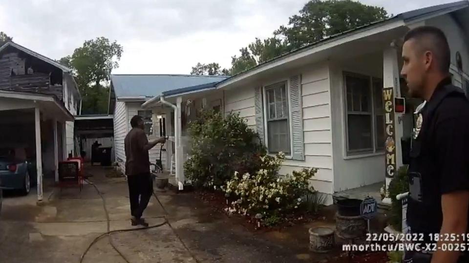 A still from body cam from the Childersburg (Ala.) Police Department, released by attorneys for Michael Jennings, a longtime pastor at Vision of Abundant Life Church in Sylacauga, Alabama. Police arrested him May 22, 2022 for obstructing government operations. Jennings said he was watering the flowers for his neighbor who was away. Charges were dropped in June.