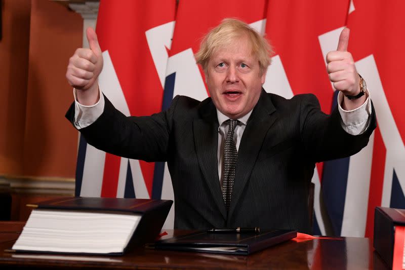 FILE PHOTO: Britain's Prime Minister Boris Johnson signs the Brexit trade deal with EU