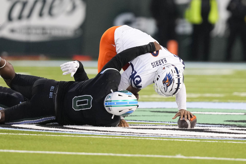 UTSA quarterback Frank Harris is sacked by Tulane defensive lineman Patrick Jenkins (0) in the second half of an NCAA college football game in New Orleans, Friday, Nov. 24, 2023. Tulane won 29-16. (AP Photo/Gerald Herbert)