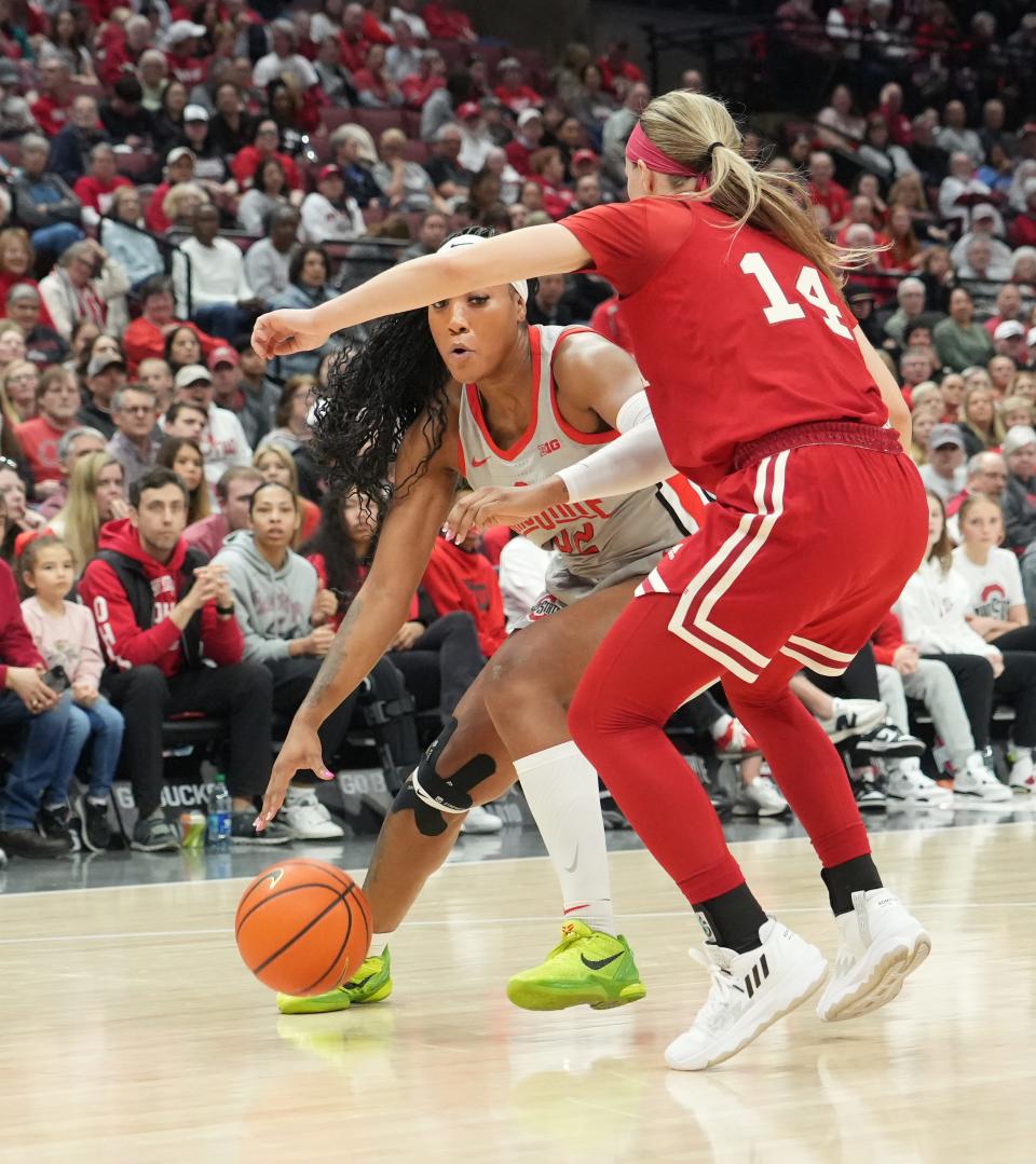 Ohio State forward Cotie McMahon moves around Indiana's Sara Scalia on Sunday. McMahon had 20 points and seven rebounds in the game.