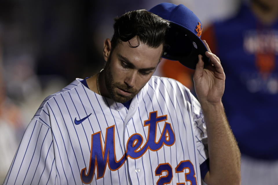 New York Mets pitcher David Peterson reacts after being taken out of the team's baseball game against the Chicago Cubs during the first inning Wednesday, Sept. 14, 2022, in New York. (AP Photo/Adam Hunger)