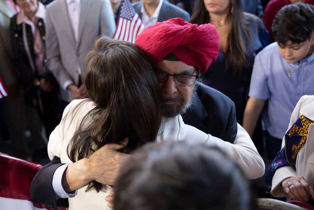 <p>LOGAN CYRUS/AFP via Getty</p> Nikki Haley embraces her father, Ajit Singh Randhawa, during a campaign event to launch her presidential bid on Feb. 15, 2023