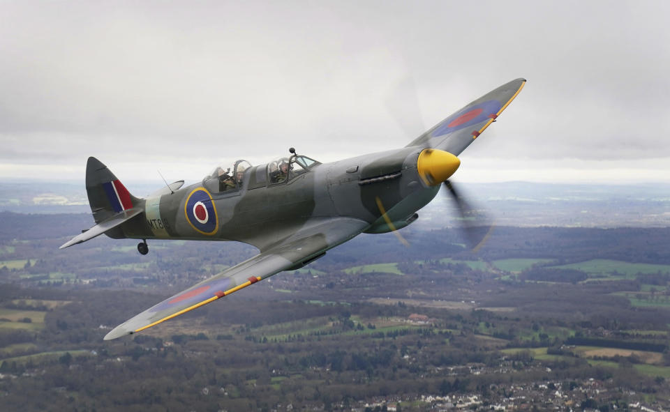 102-year-old Jack Hemmings, back, AFC, flies a Spitfire plane to mark 80th anniversary of the military charity Mission Aviation Fellowship (MAF), after taking off from London Biggin Hill, England, Monday, Feb. 5, 2024. The former RAF Squadron Leader and pioneer of MAF, the world's largest humanitarian air service, hoped to become the oldest Briton to fly in a spitfire. Hemmings took to the skies in Britain's best-loved Second World War aircraft to raise money for MAF, the charity he co-founded almost 80 years ago. (Gareth Fuller/PA via AP)