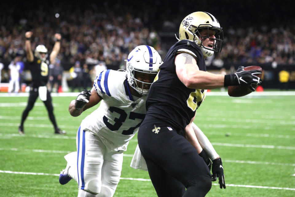 New Orleans Saints quarterback Drew Brees (9) celebrates as he sets a career touchdown record with a touchdown pass to tight end Josh Hill (89) as Indianapolis Colts safety Khari Willis (37) defends in an NFL game Monday, Dec. 16, 2019 in New Orleans The Saints defeated the Colts 34-7. (Margaret Bowles via AP)