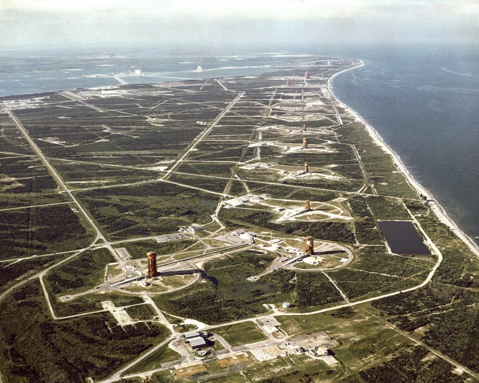 Aerial view of "missile row" at then, Cape Kennedy Air Force Station, Fla., in 1964. Missile Row included Atlas Launch Complexes 11, 12, 13 and 14, followed by Titan pads at 15,16,19 and 20.