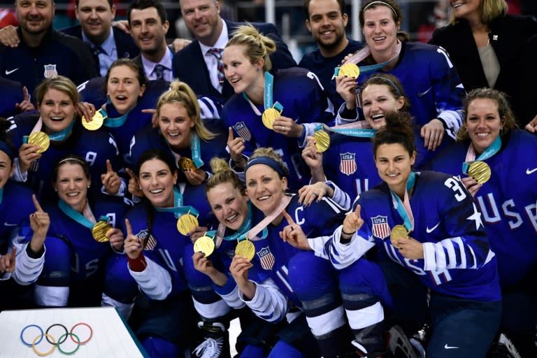 The US gold medal team celebrate after beating Canada to win their first women's Olympic ice hockey title in 20 years during the 2018 Winter Olympic Games