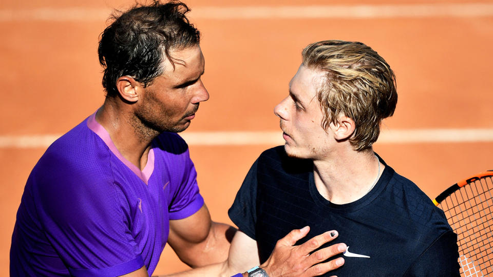 Rafael Nadal (pictured left) greets Denis Shapovalov (pictured right) at net after his victory.