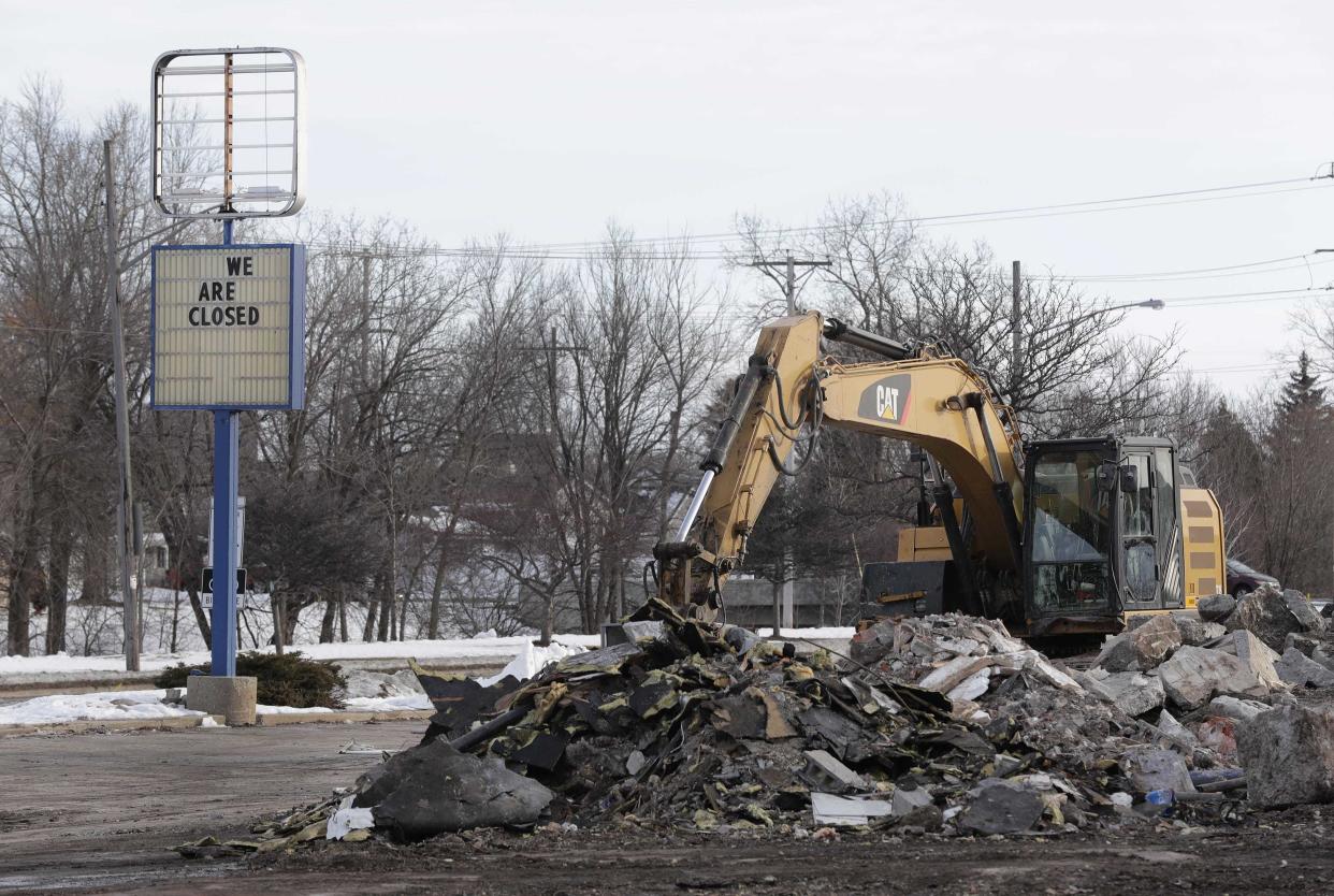 A demolition contractor razes the former Burger King restaurant on South Green Bay Road in Neenah in 2020.