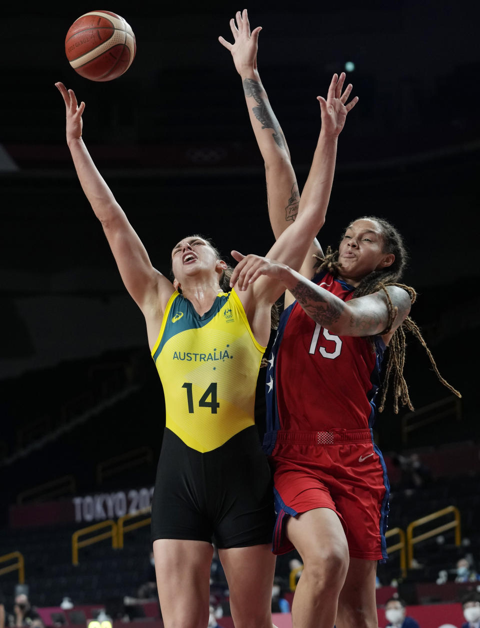 Australia's Marianna Tolo (14) drives to the basket against United States's Brittney Griner (15) during a women's basketball quarterfinal game at the 2020 Summer Olympics, Wednesday, Aug. 4, 2021, in Saitama, Japan. (AP Photo/Eric Gay)