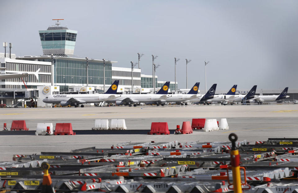 The Deutsche Lufthansa AG logo sits on the tail fins of passenger aircraft outside the terminal at Munich airport in Munich, Germany, on Wednesday, June 3, 2020. Deutsche Lufthansa AGÂ signaled the start of aÂ company-wide revamp spanning job cuts to asset disposals to help repay its 9 billion-euro ($10 billion) bailout from the German government. Photographer: Michaela Handrek-Rehle/Bloomberg