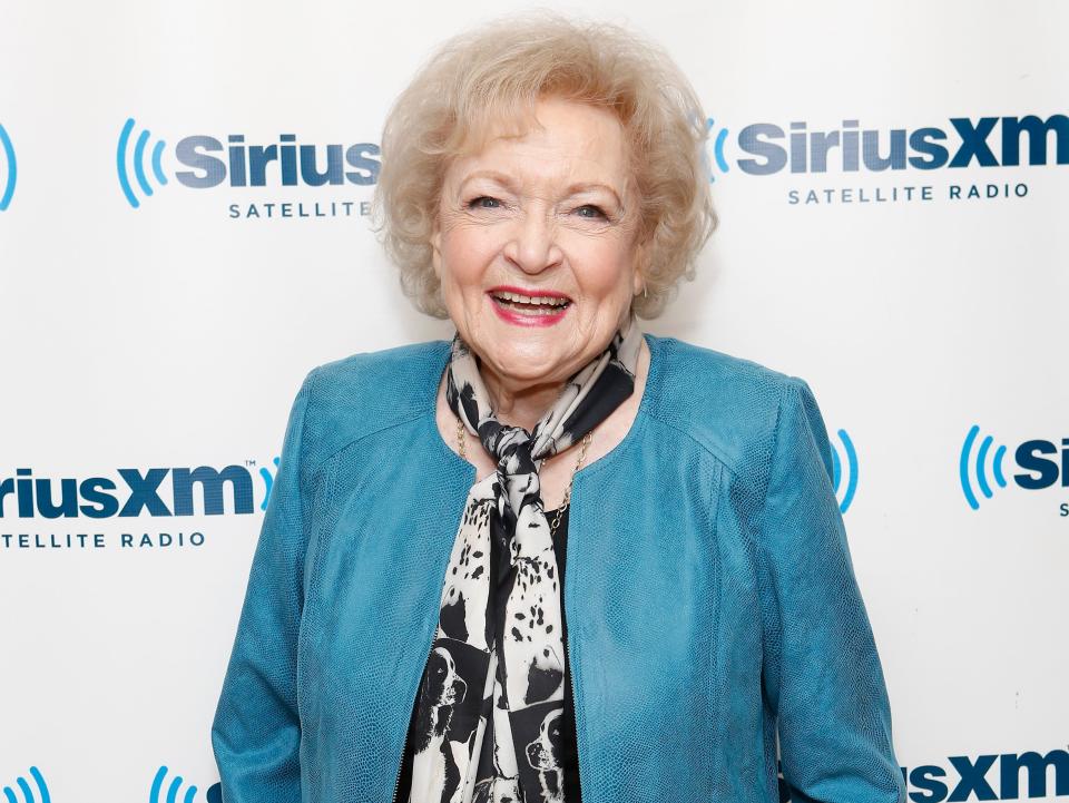 Betty White in a teal jacket