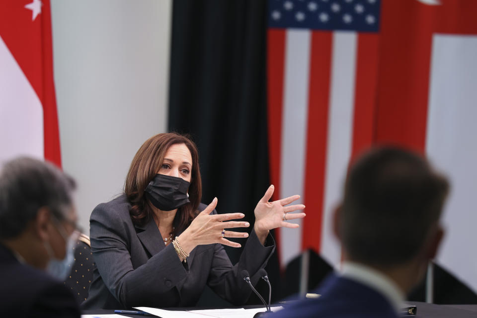 U.S. Vice President Kamala Harris, center, attends a roundtable at Gardens by the Bay in Singapore before departing for Vietnam on the second leg of her Southeast Asia trip, Tuesday, Aug. 24, 2021. (Evelyn Hockstein/Pool Photo via AP)