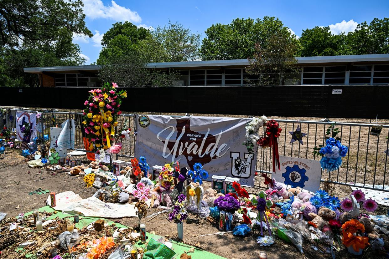 Mementos decorate a makeshift memorial to the victims of a shooting at Robb Elementary School in Uvalde, Texas, on June 30, 2022. 