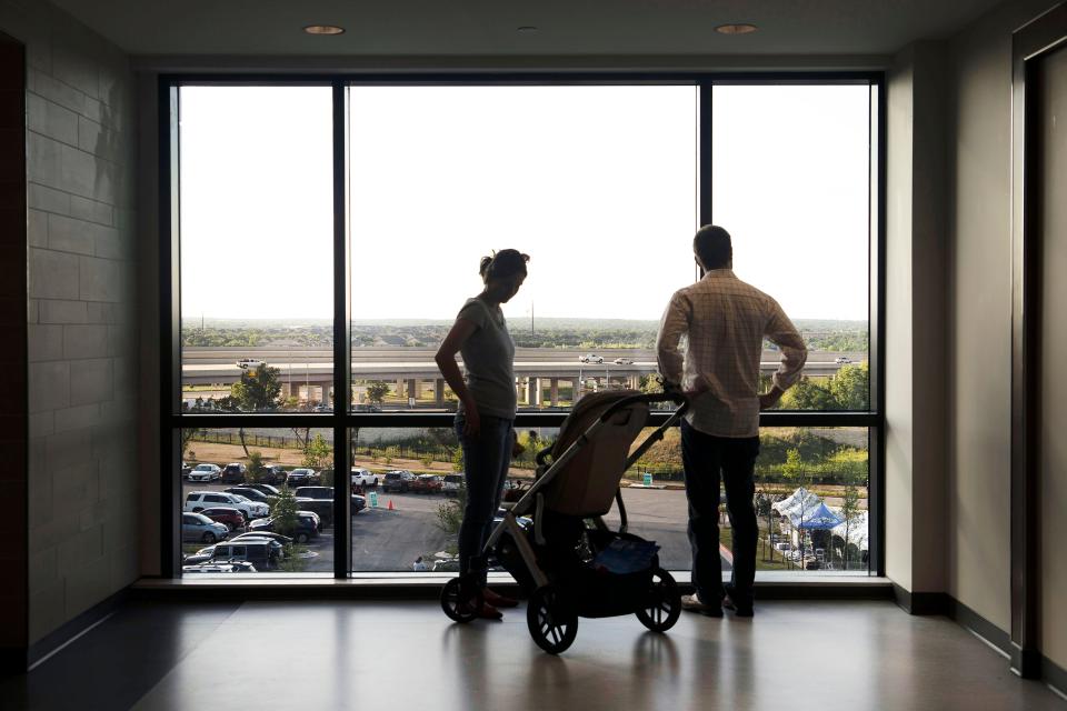 Jolien Sewer and Alex Foster check out the view from the third floor of the new hospital. Ronald McDonald House Charities of Central Texas has a third-floor suite with a large living room space for parents and guardians.