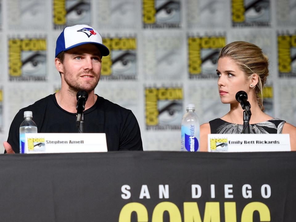 Stephen Amell, left, and Emily Bett Rickards attend the "Arrow" panel on day 3 of Comic-Con International on Saturday, July 23, 2016, in San Diego.