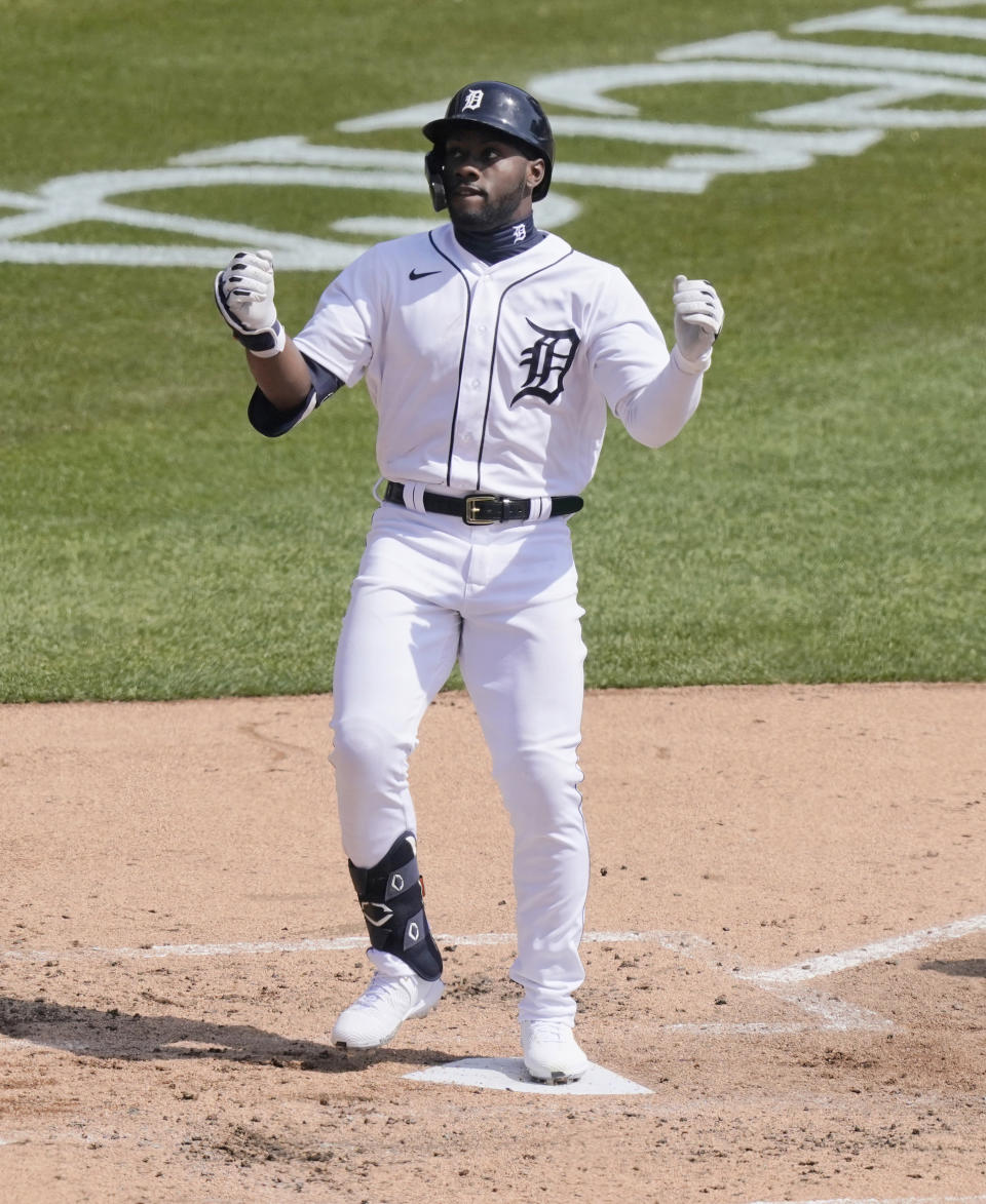 Detroit Tigers' Akil Baddoo reacts at home plate after his solo home run during the third inning of a baseball game against the Cleveland Indians, Sunday, April 4, 2021, in Detroit. (AP Photo/Carlos Osorio)