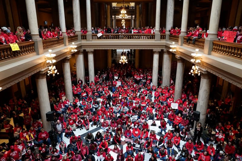 Educators and their supporters gather in the Capitol Building as teachers hold a one day walkout at the statehouse in Indianapolis