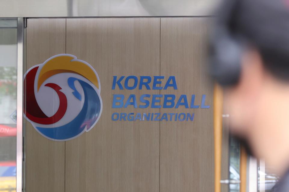 A logo of the Korea Baseball Organization is posted on a wall in Seoul, South Korea, Sunday, July 11, 2021. South Korea's professional baseball league has suspended its regular season as the largely unvaccinated country grapples with the worst wave of the coronavirus since the start of the pandemic.