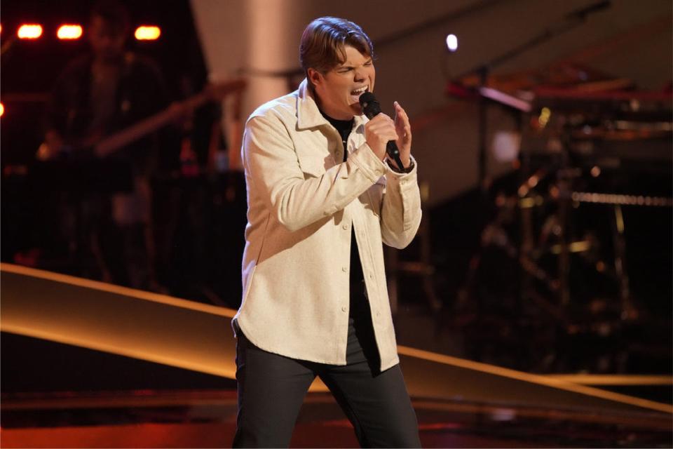 Ducote Talmage, a firefighter from Auburn, sings during knockouts on NBC's "The Voice."