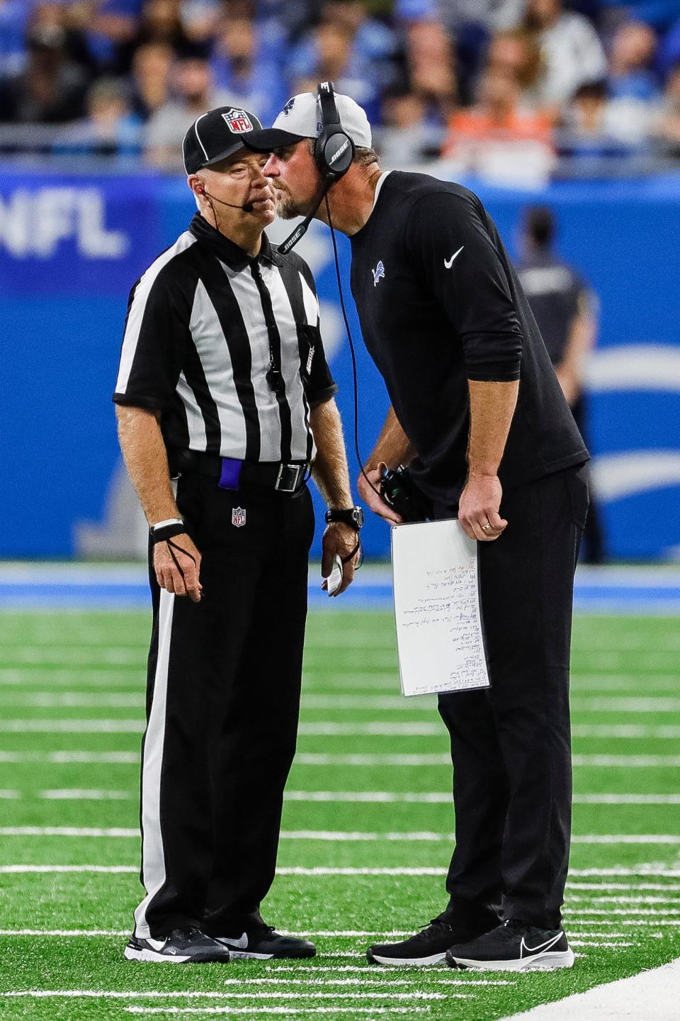 Lions coach Dan Campbell talks to a referee during the a play challenge during the second half of the Lions' 19-17 loss at Ford Field on Sunday, Sept. 26, 2021.