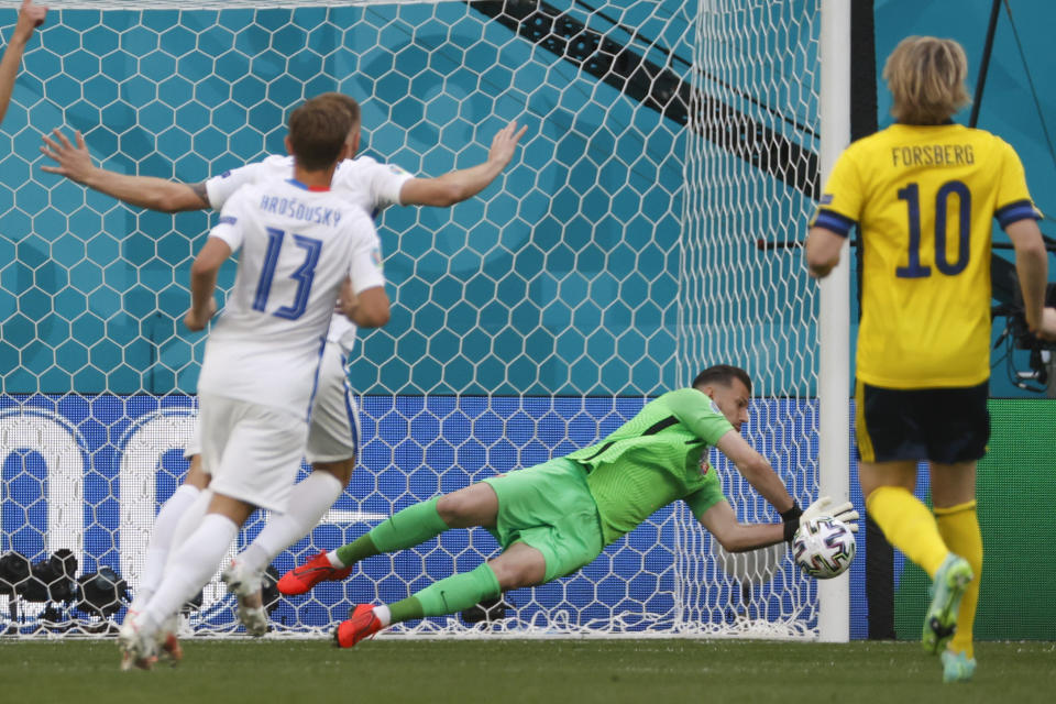 Slovakia's goalkeeper Martin Dubravka makes a save during the Euro 2020 soccer championship group E match between Sweden and Slovakia, at the Saint Petersburg stadium, in Saint Petersburg, Russia, Friday, June 18, 2021. (Anatoly Maltsev, Pool via AP)