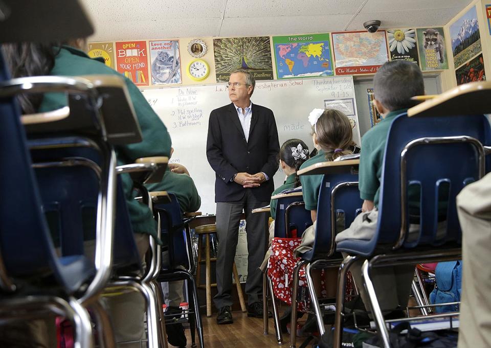 Former Florida Gov. Jeb Bush visits students in a third grade class  in Miami, Fla., in September 2015.