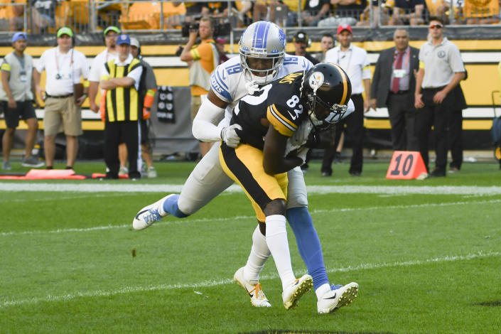 Pittsburgh Steelers wide receiver Steven Sims (82) makes a touchdown catch as Detroit Lions cornerback Saivion Smith (19) defends during the first half of an NFL preseason football game, Sunday, Aug. 28, 2022, in Pittsburgh. (AP Photo/Fred Vuich)