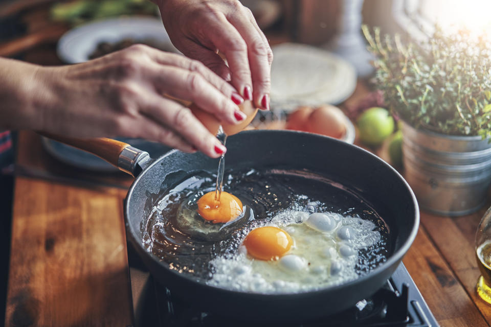 A person cooking eggs