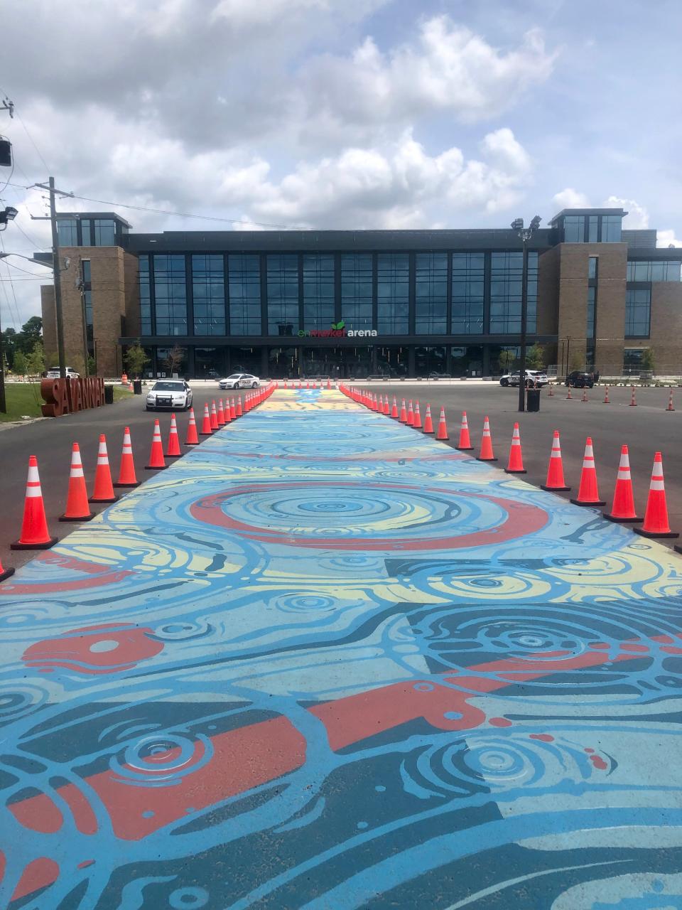 Completed Water Works Mural in front of the Enmarket Arena, designed by Xavier "Zay" Hutchins, Nae'Keisha Jones, Alfredo Martinez and Brian MacGregor.