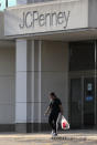 In this Wednesday, Aug. 14, 2019, photo photo a shopper leaves the JCPenney store in Peabody, Mass. J.C. Penney Co. on Thursday, Aug. 15, reported a loss of $48 million in its fiscal second quarter. (AP Photo/Charles Krupa)