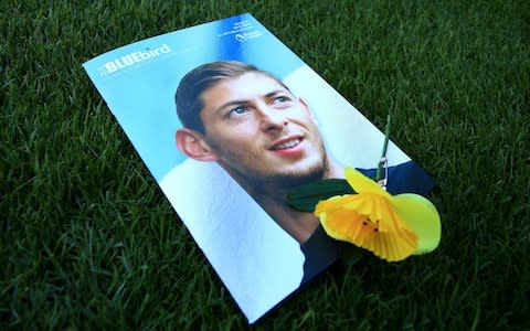 Cardiff City match-day programme with photograph of Emiliano Sala on its cover - Police investigate Willie McKay amid Cardiff City ‘kill’ threat allegation - Credit: PA