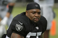 FILE - In this July 29, 2019, file photo, Oakland Raiders linebackers Vontaze Burfict gets up after stretching during NFL football training camp in Napa, Calif. Burfict has been suspended for the rest of the season for a helmet-to-helmet hit on Indianapolis Colts tight end Jack Doyle, on Sunday, Sept. 29, 2019. NFL Vice President of football operations Jon Runyan announced the suspension Monday. (AP Photo/Eric Risberg, File)