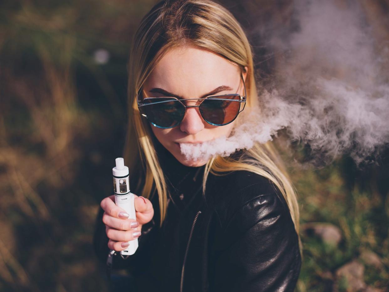 woman vaping vape e-cig