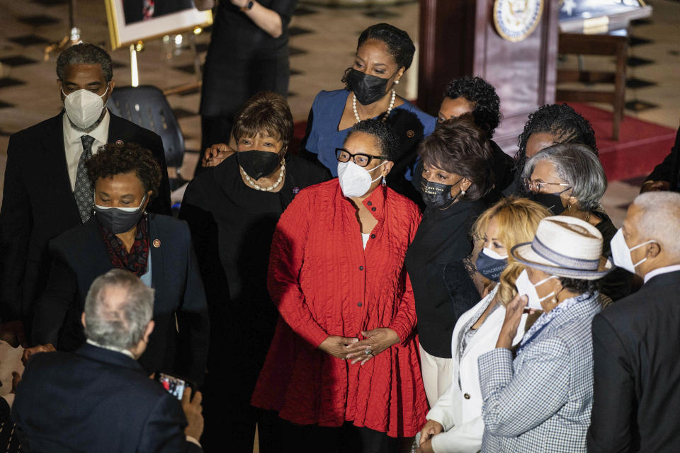 Marcia Fudge, Secretary of Housing and Urban Development, takes a photo with members of the Congressional Black Caucus before a Celebration of Life for Rep. Alcee Hastings, D-Fla., in Statuary Hall on Capitol Hill in Washington, Wednesday, April 21, 2021. Hastings died earlier this month, aged 84, following a battle with pancreatic cancer. (Anna Moneymaker/The New York Times via AP, Pool)