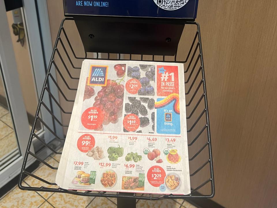 Aldi weekly ads in a stand