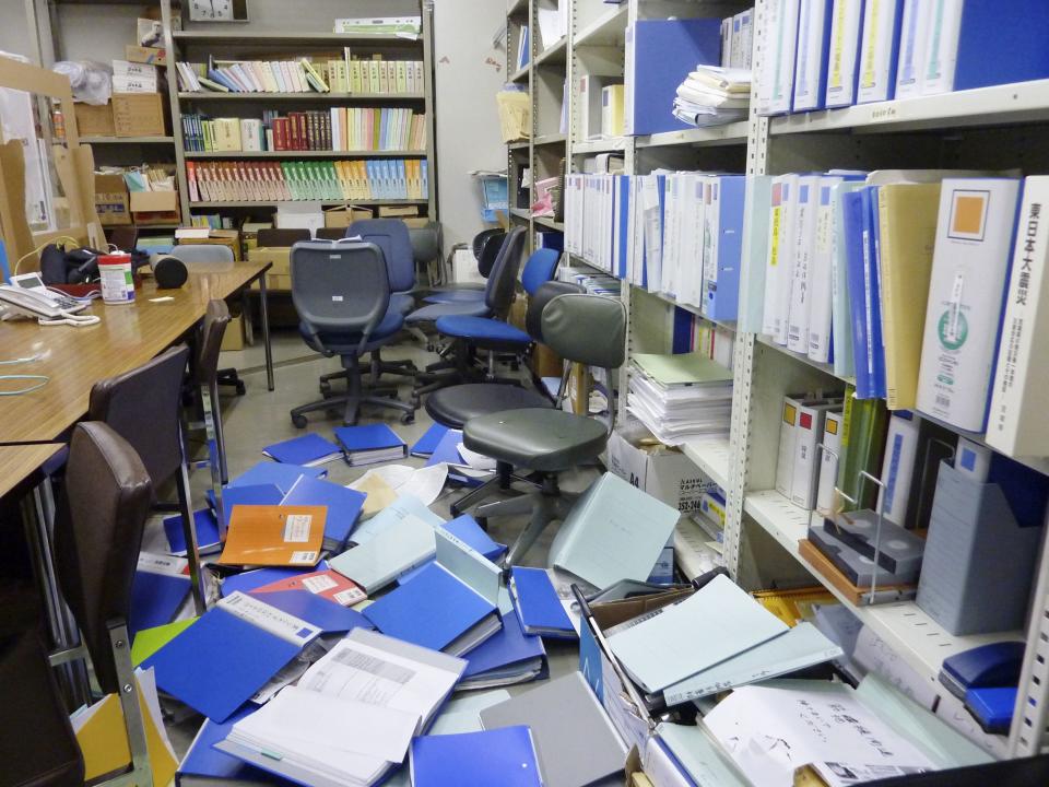 File folders are seen scattered on the floor of the Kyodo News bureau after a strong quake in Sendai, Miyagi PrefectureREUTERS