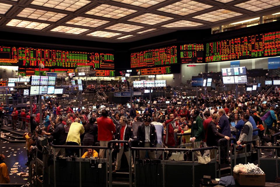 Traders work on the trading floor at the CME Group on February 11, 2011. (Photo by Scott Olson/Getty Images)