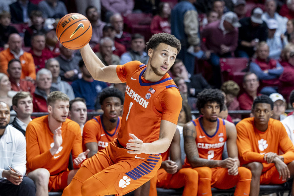 Clemson guard Chase Hunter (1) rebounds the ball against Alabama during the first half of an NCAA college basketball game, Tuesday, Nov. 28, 2023, in Tuscaloosa, Ala. (AP Photo/Vasha Hunt)