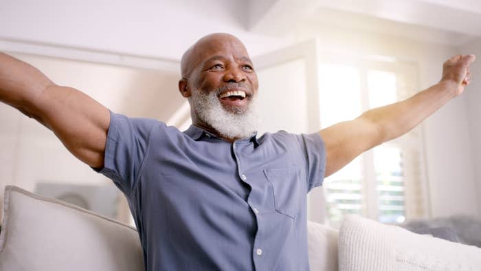 man with his arms out in excitement