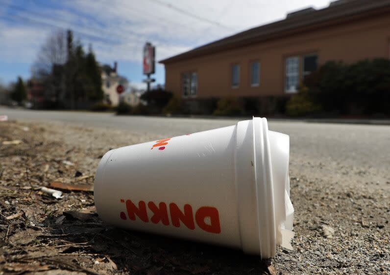 A coffee cup made from polystyrene foam, commonly known as Styrofoam, lies on the side of a road, Wednesday, May 1, 2019, in Augusta, Maine. Gov. Janet Mills signed a bill into law Tuesday, April 30 making Maine one of the first states to ban single-use containers made from polystyrene foam. (AP Photo/Robert F. Bukaty)