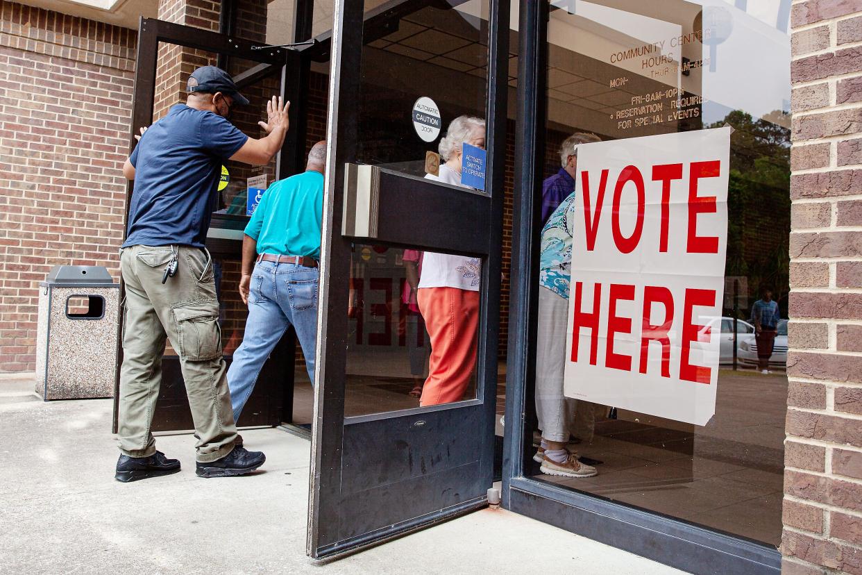 Voters walk into the Rainbow City Community Center on Tuesday, May 24, 2022, to vote in the Alabama primaries.