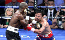 Timothy Bradley (L) of the US connects against Manny Pacquiao (R) of the Philippines during their WBO welterweight title match at the MGM Grand Arena on June 9, 2012 in Las Vegas, Nevada. In what is being viewed as a highly controversial outcome, unbeaten Bradley ended Pacquiao's long unbeaten run with a split decision victory over the Filipino ring icon. AFP PHOTO / John GurzinskiJOHN GURZINSKI/AFP/GettyImages