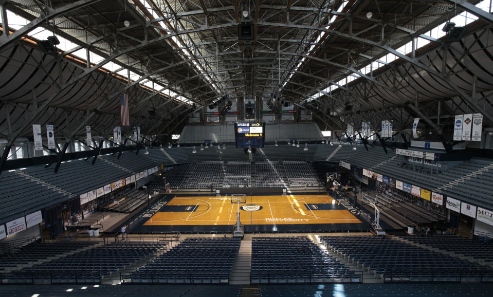 FILE - In this March 30, 2010, file photo, light shines through the windows onto the basketball court at Butler University's Hinkle Fieldhouse in Indianapolis. The NCAA announced Monday, Jan. 4, 2021, that all 67 men's basketball tournament games including the Final Four will be played entirely in Indiana in a bid to keep the marquee event from being called off for a second consecutive year because of the coronavirus pandemic. Games will be played on two courts inside Lucas Oil Stadium as well as at Bankers Life Fieldhouse, Hinkle Fieldhouse, Indiana Farmers Coliseum, Mackey Arena at Purdue and Assembly Hall in Bloomington. Only one game at a time will be played at Lucas Oil Stadium. (AP Photo/AJ Mast, File)