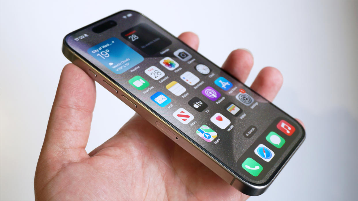  IPhone 15 Pro review front angled handheld. 