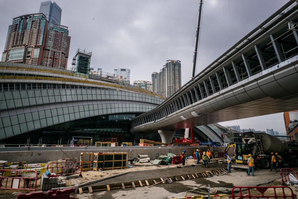 Labourers work on the construction site of the West Kowloon terminus of the high-speed rail link which will connect the city to the southern Chinese city of Guangzhou in Hong Kong on Dec. 28, 2017.